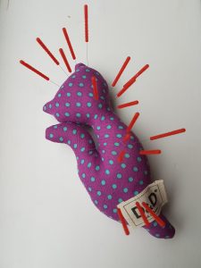 Cat pin cushion with acupuncture needles